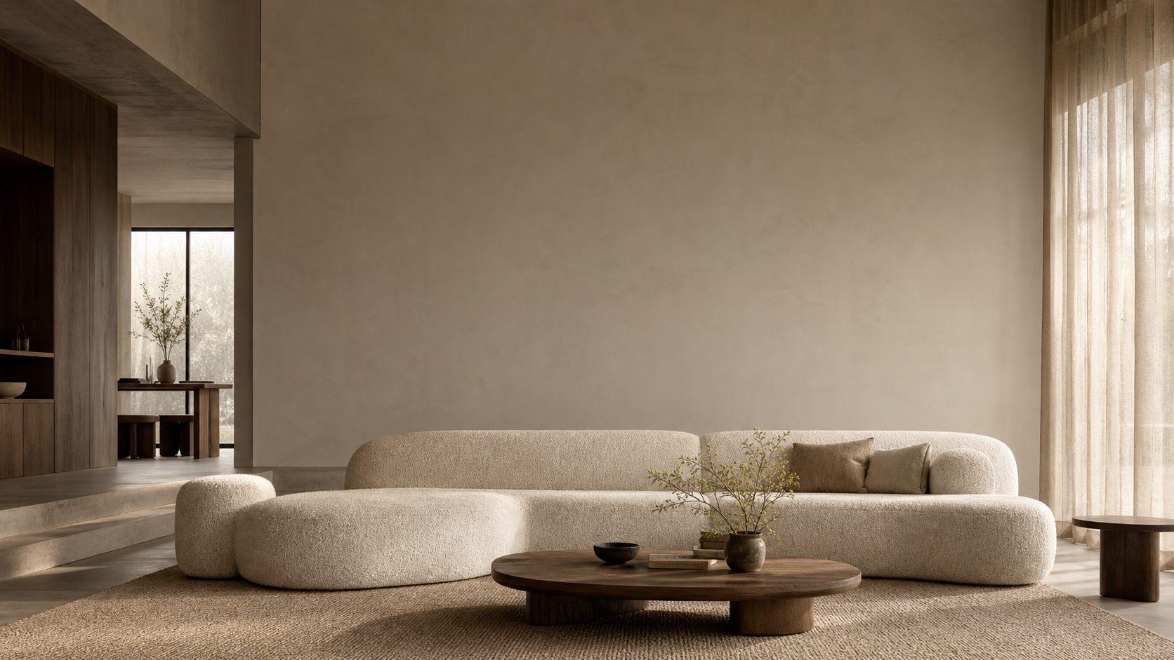 A warm living room with a cream sofa, natural wood, and soft afternoon light